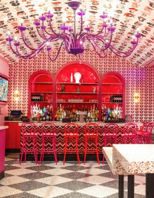 A Room With A Table And Chairs