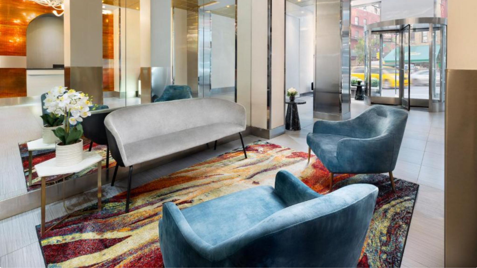 A Room With A Couch And Chairs